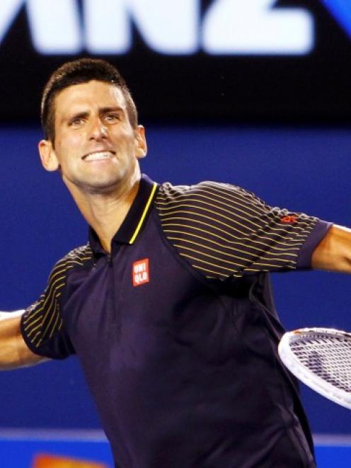 Novak Djokovic of Serbia celebrates defeating David Ferrer of Spain in their men's singles semi...