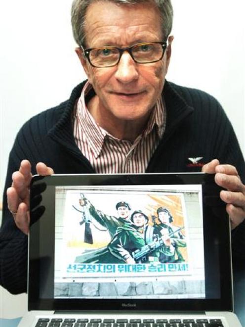 Nuclear-free Korea? Prof Herbert Wulf, a visiting researcher, displays a photograph of a...