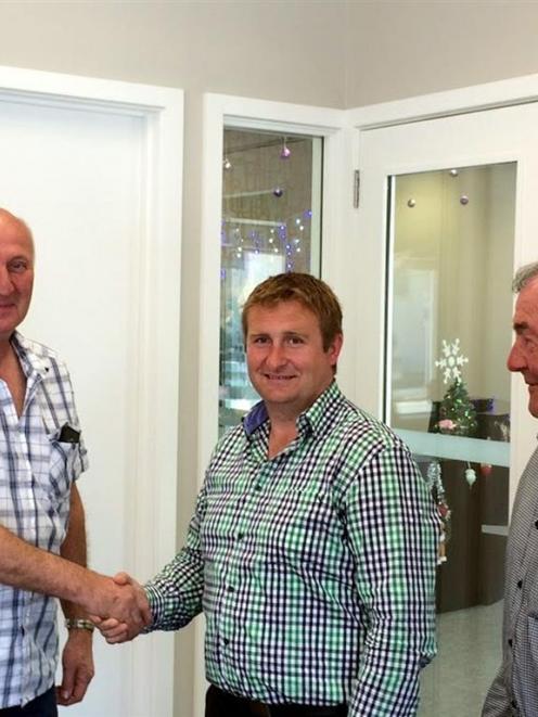 Oamaru Club president Steve Begley (left) and vice-president Trevor Williams congratulate new...