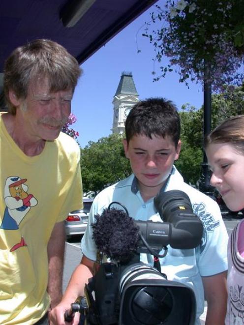 Oamaru film-maker Eric Shepherd (left) with Alex Mabon (12) and Emma Cullimore (12), who will be...