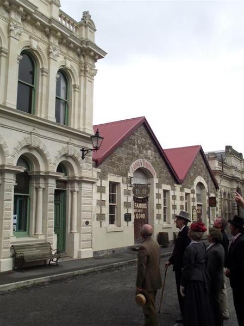 Oamaru Whitestone Civic Trust chairman Phil Hope (right)  points out features of historic...