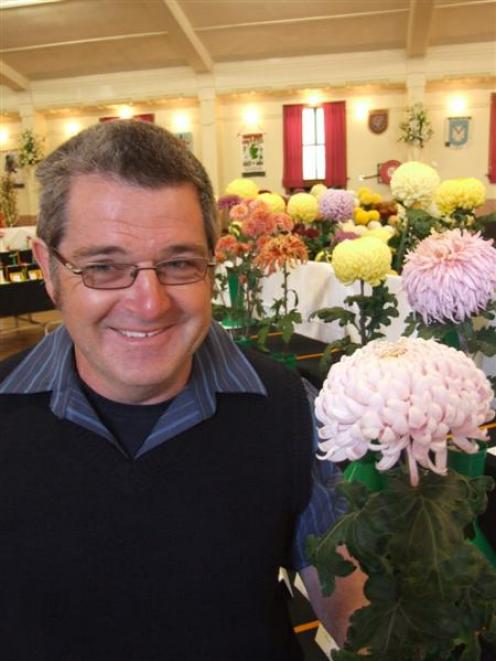 Wayne Shaw with one of his chrysanthemums at the North Otago Horticultural Society's show at the...