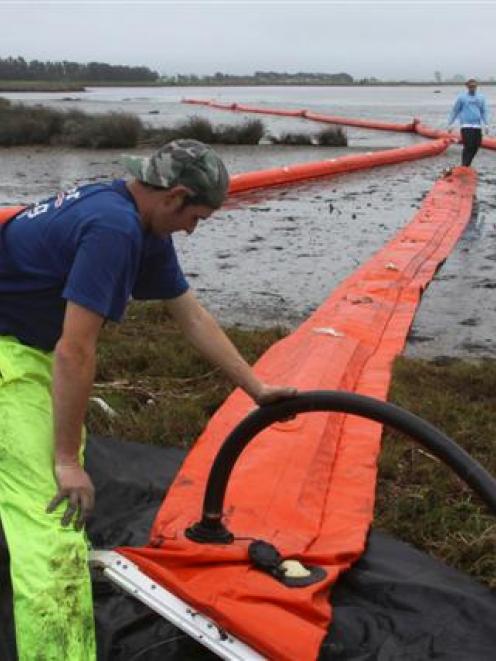 Oil booms are prepared at the Maketu Estuary. Maritime New Zealand