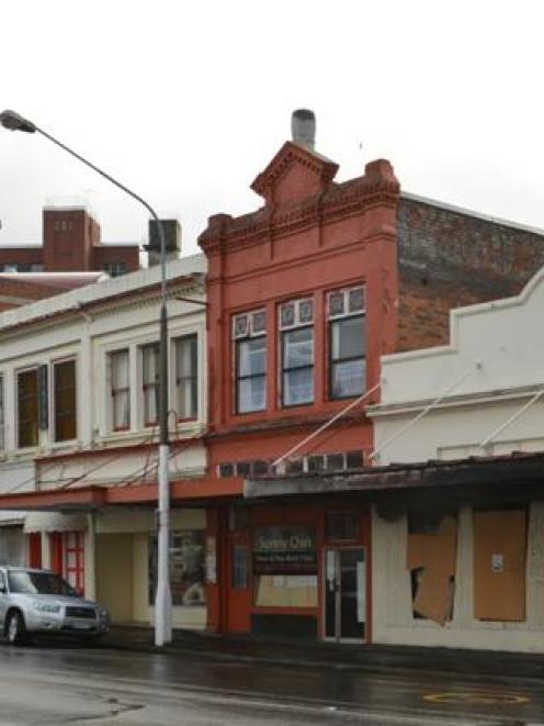 Older buildings, including the empty former Furniture Court building (left) and the empty former...