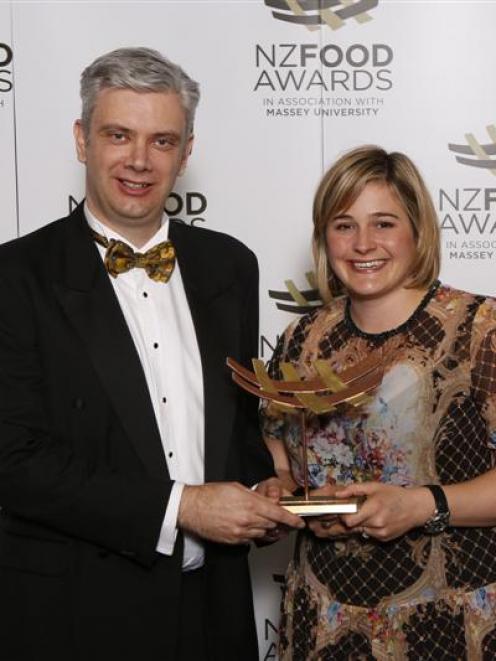 Olivia Egerton, from Alpine Origin Merino, receives the KPMG export innovation award from Ian...