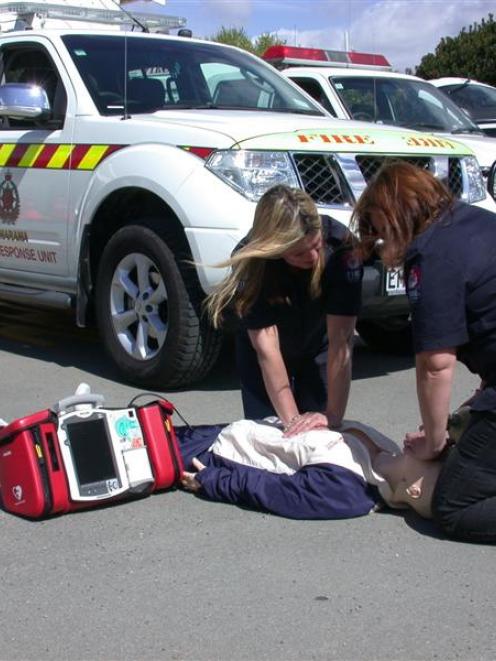 Omarama Fire Brigade first-response officers Sharon Reeves (left) and Juliet Bryant work with the...