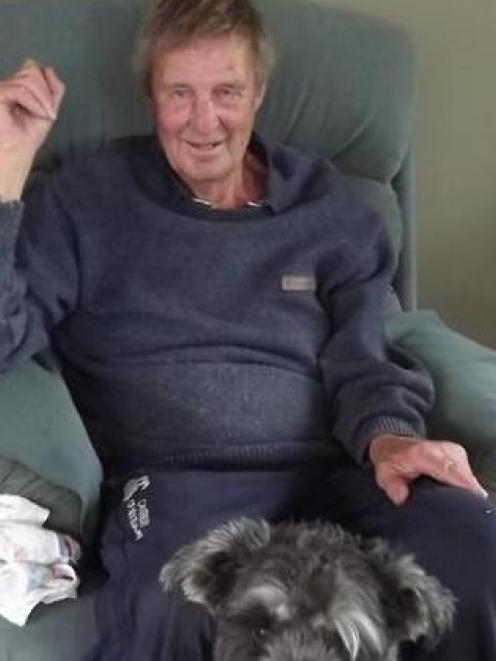 Omarama man Rodney Murdoch,  with  his grey and white giant schnauzer. Photo supplied.