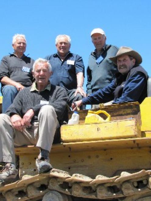 On a D8 dozer similar to one they used when working on the Haast Pass in the 1950s are (from left...