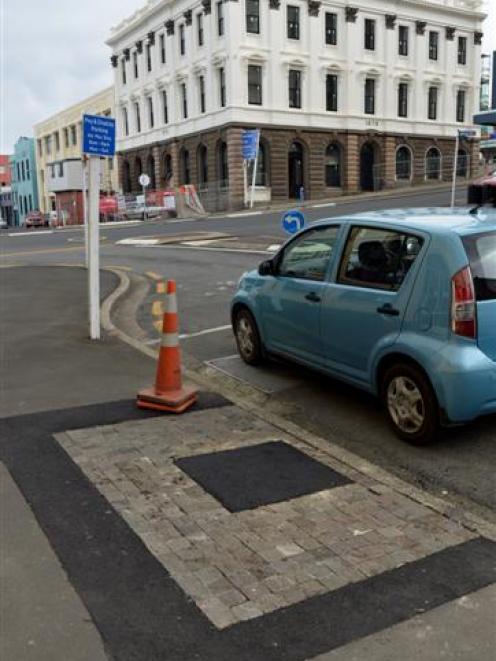 One of four ''tree pits'' in Bond St, Dunedin, that was filled in this week because it was too...