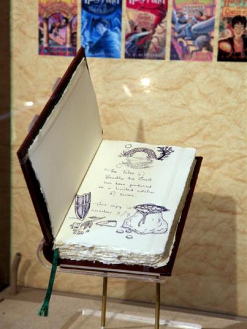 One of only seven original copies of "The Tales of Beedle the Bard," created, handwritten and...