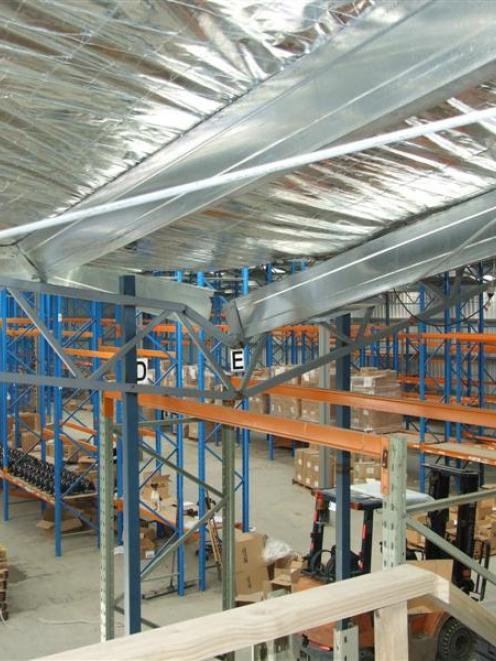 One of the buckled trusses along the collapsed roof of Tuapeka Gold Print's mostly empty...