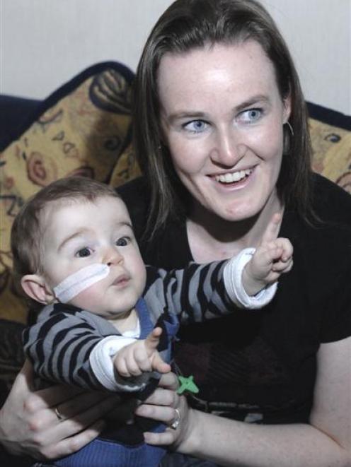 Only a feeding tube gives away the fact the health of Dunedin toddler Reuben Jones (1), with his...