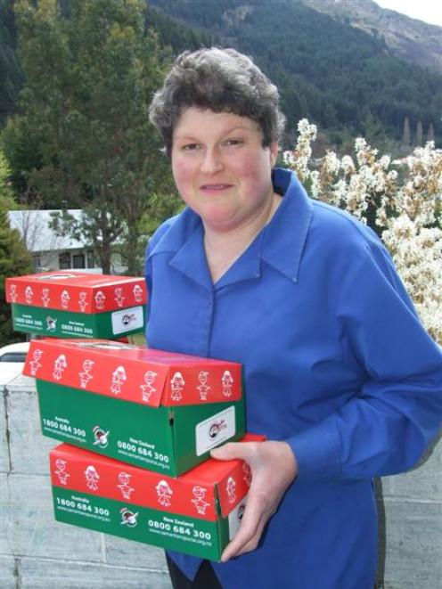 Operation Christmas Child Queenstown co-ordinator Sharon Hargest with some of the shoeboxes which...
