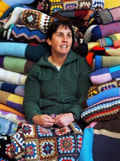 Operation Cover Up Dunedin co-ordinator Shona Bovey sits among some of the donated items for this...