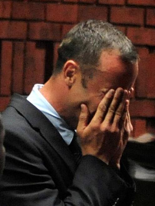 Oscar Pistorius breaks down during his court appearance in Pretoria. REUTERS/Antonie de Ras