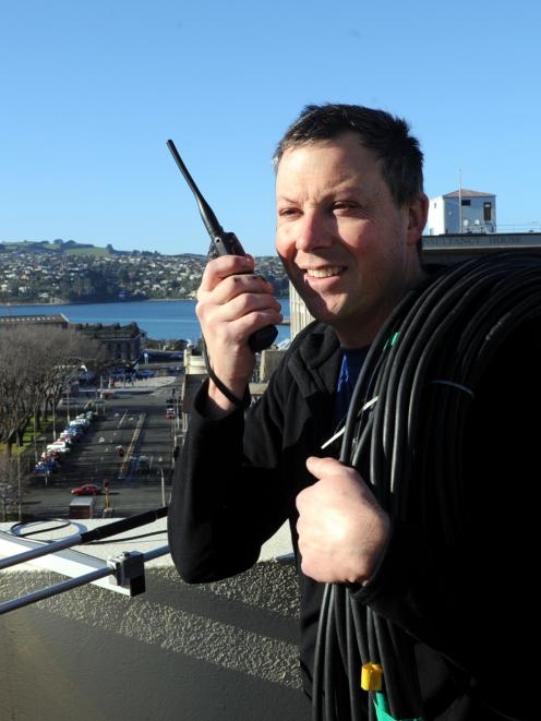 Otago Amateur Radio Emergency Communications  team leader Lindsey Ross tests his radio as ...