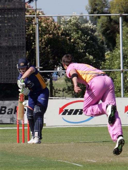 Otago batsman Neil Broom plays a straight bat to a delivery from Northern Districts bowler Graeme...