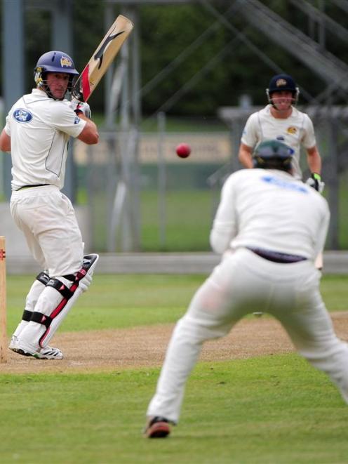 Otago batsman Warren McSkimming watches the ball travel into the waiting hands of Auckland's...