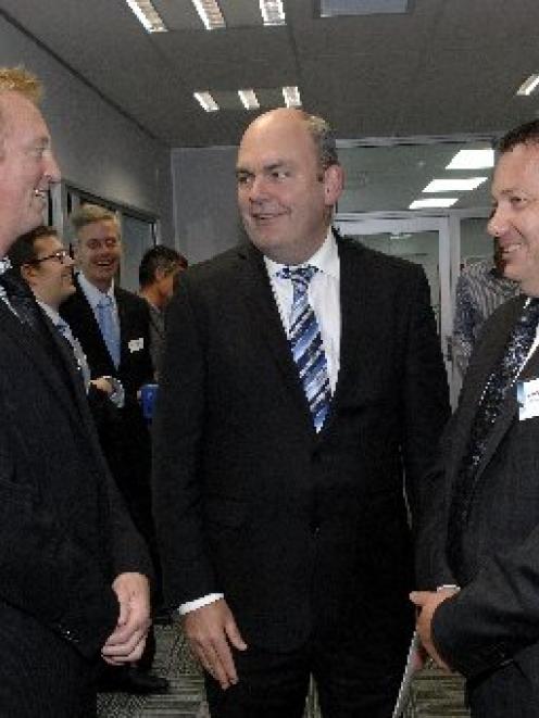 Otago Chamber of Commerce president Peter McIntyre (left) shares a chuckle with Economic...