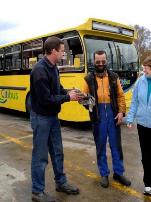 Otago Heritage Bus Society member Alastair Stewart (left), Citibus mechanic Mike Jeffery and...