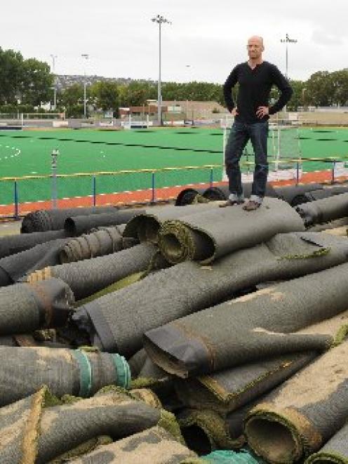 Otago Hockey chief executive Chris Aubin stands on top of the remnants of the old sand-based turf...