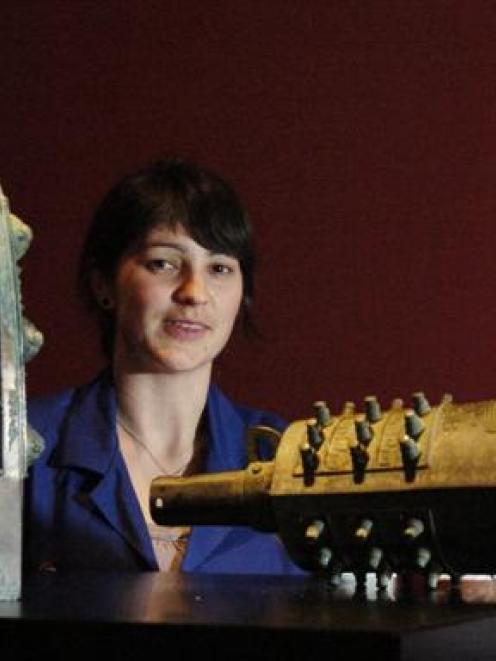 Otago Museum design services co-ordinator, Rebecca McMaster examines two ancient Chinese bronze...