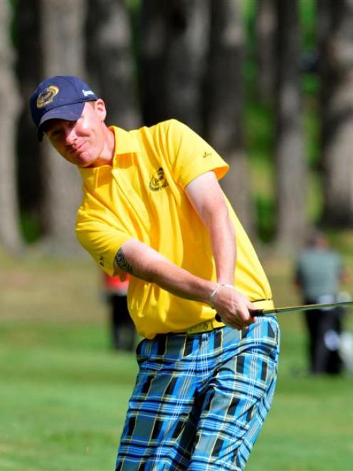 Otago No 1 Brent McEwan pitches to the 17th green during the opening round of the New Zealand...