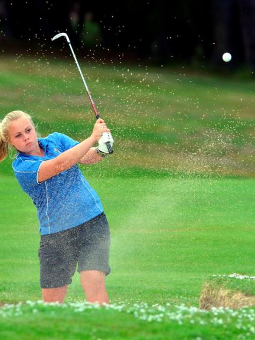 Otago No 1 Laura Hoskin plays from a greenside bunker on the 11th hole during her 4 and 3 win...