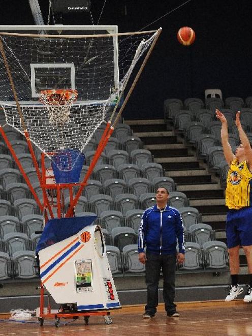 Otago Nuggets forward Tom Rowe practises his mid-range jumper with the aid of the Gun 8000 at the...