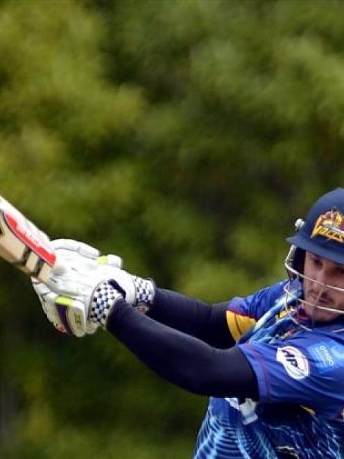Otago opener Hamish Rutherford smashes another boundary on his way to 79 against Wellington in...