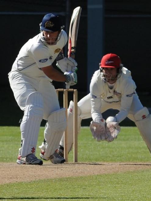 Otago opening batsman Hamish Rutherford keeps his eye on the ball during his innings of 67...