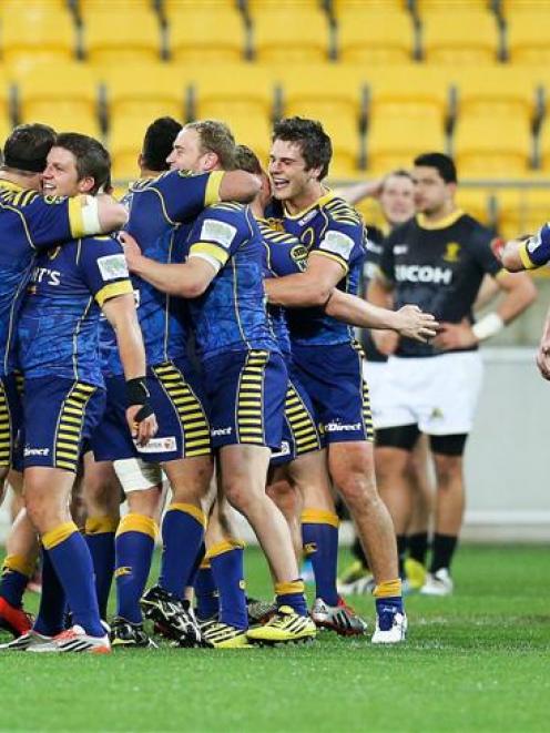 Otago players celebrate after beating Wellington 37-36. Photo: Getty Images.