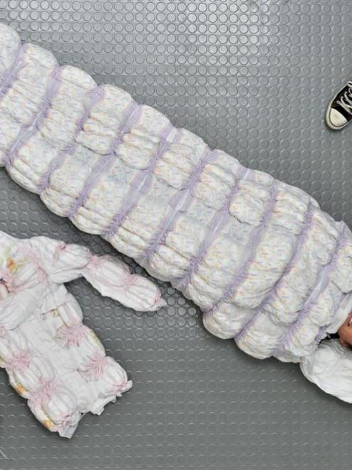 Otago Polytechnic School of Art third-year textile student Bridie-Rose O'Leary (22) wraps herself...