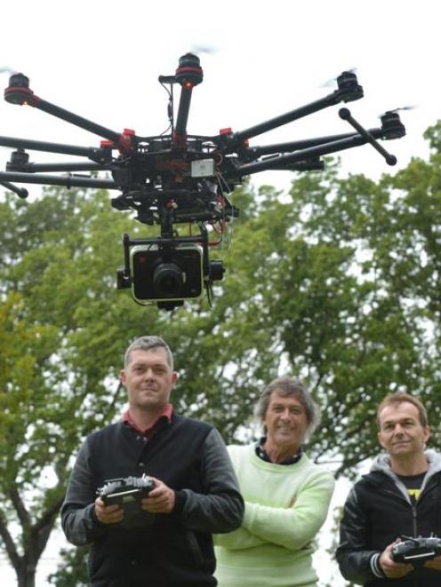 Otago Polytechnic student Aaron McGrouther (left) flies Animation Research Ltd's new drone at...