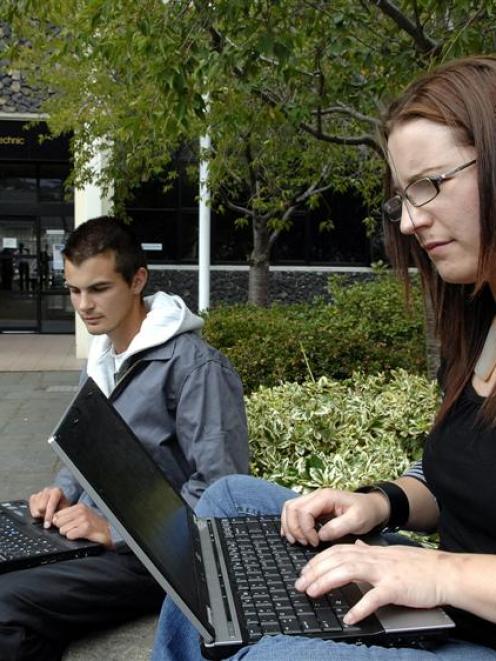 Otago Polytechnic students Matthew Cleland and Angela Meikle log on to the internet using the new...