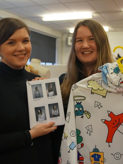 Otago Polytechnic third-year fashion design students Kenya Quin (left) and Sophie Ball hold some...
