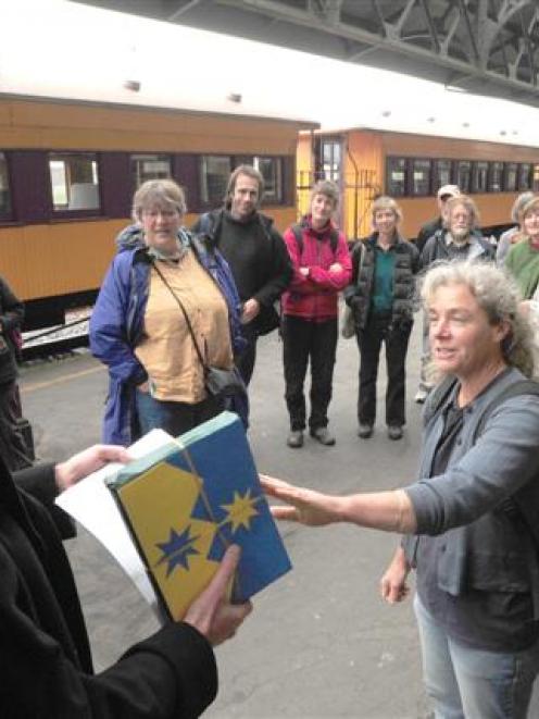 Otago Regional councillor Michael Deaker accepts a petition and submissions seeking a commuter...