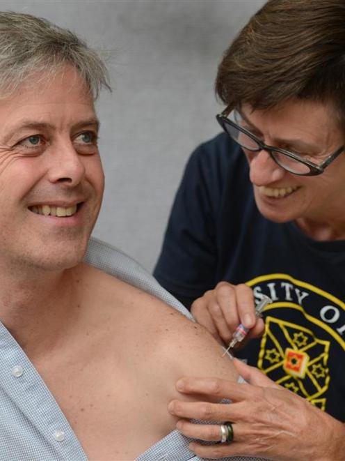 Otago research and enterprise deputy vice-chancellor Prof Richard Blaikie receives his flu...