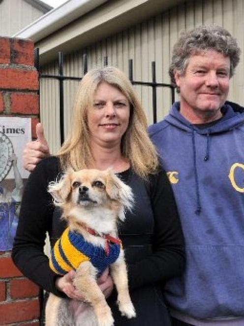 Otago rugby supporters Margaret Grundy, Stu Carse and their chihuahua-maltese cross Emma show...