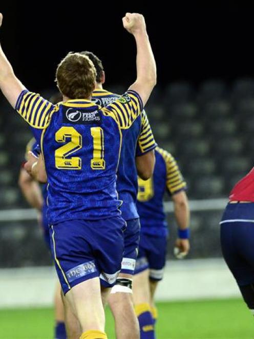 Otago second five-eighth Glenn Dickson (left) and replacement back Michael Collins raise their...