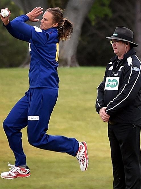 Otago Sparks captain Suzie Bates rolls her arm over in front of umpire Mike George at Molyneux...