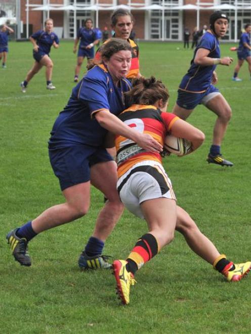 Otago Spirit hooker Lucy Emery wraps up Waikato halfback Patricia Garcia at the University Oval...