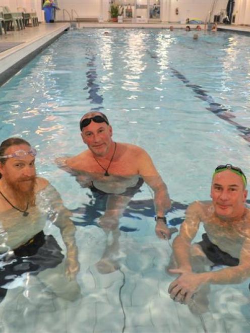 Otago Therapeutic Pool regulars (from left) Mark Baxter and twins Stephen and Allan Facer chat...