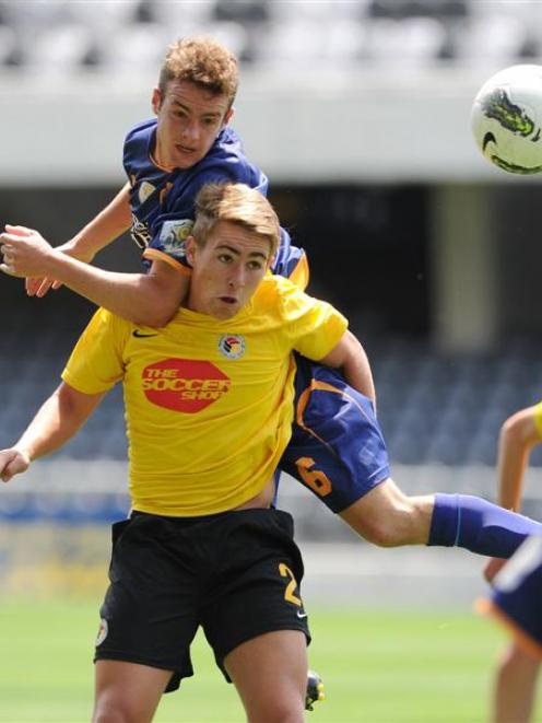 Otago United player Morgan Day (top) and Waikato's Tyler Boyd compete during their ASB...