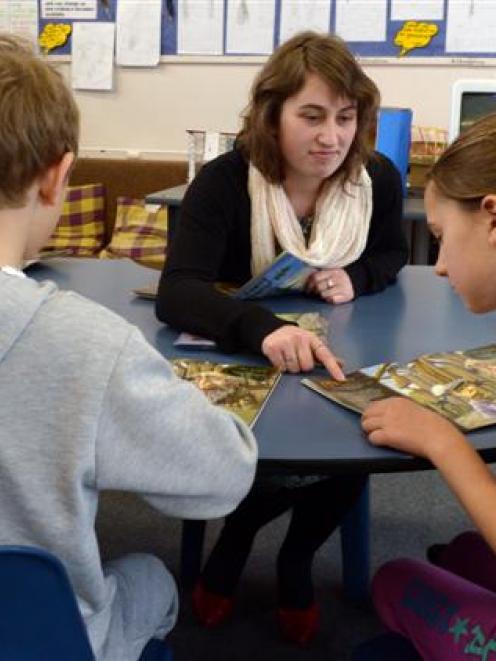 Otago University College of Education student Sacha Hatton (21) takes a reading lesson at George...