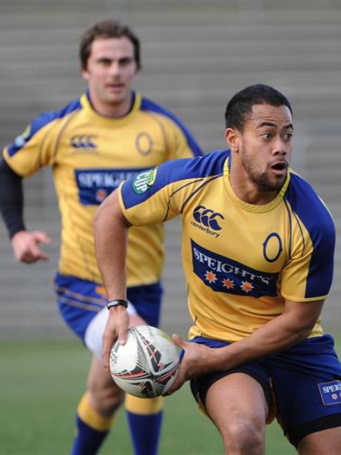 Otago winger Buxton Popoali'i looks to move the ball in training at Carisbrook on Thursday....