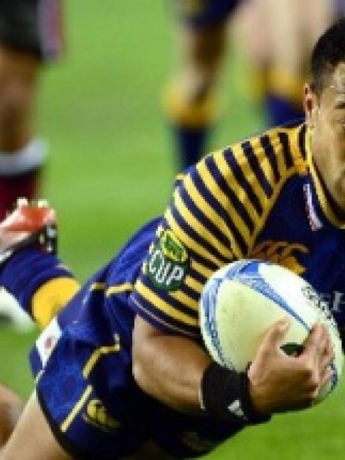 Otago winger  Buxton Popoali'i scores a try against North Harbour in their ITM Cup clash at...