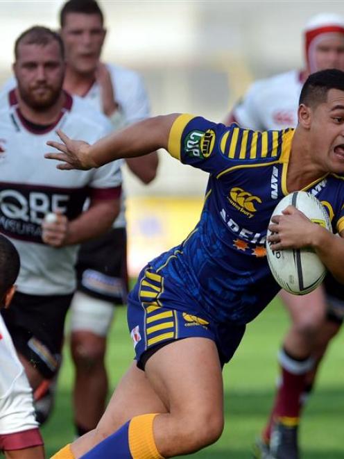 Otago winger Fa'asiu Fuatai heads in for one of his two tries against North Harbour at Forsyth...