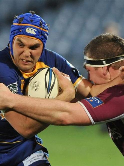 Otago winger Ryan Shortland tries to fend off of Southland prop Chris King during the teams' Air...
