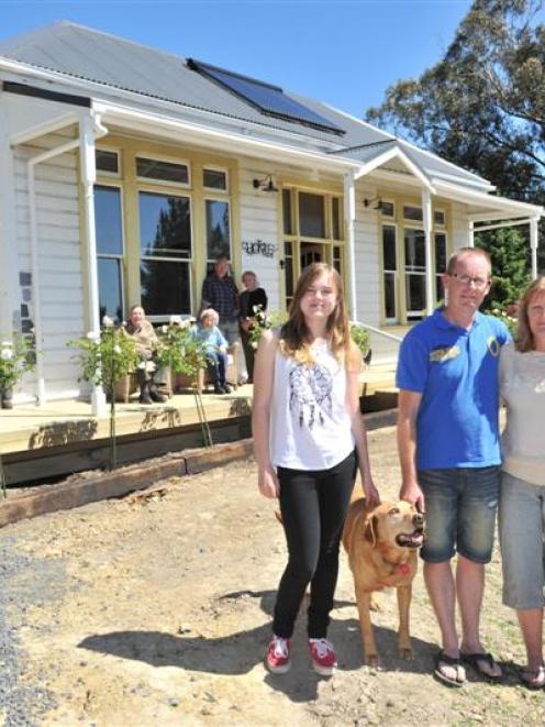 Outside a relocated and renovated 99-year-old villa in East Taieri this week are  new residents ...